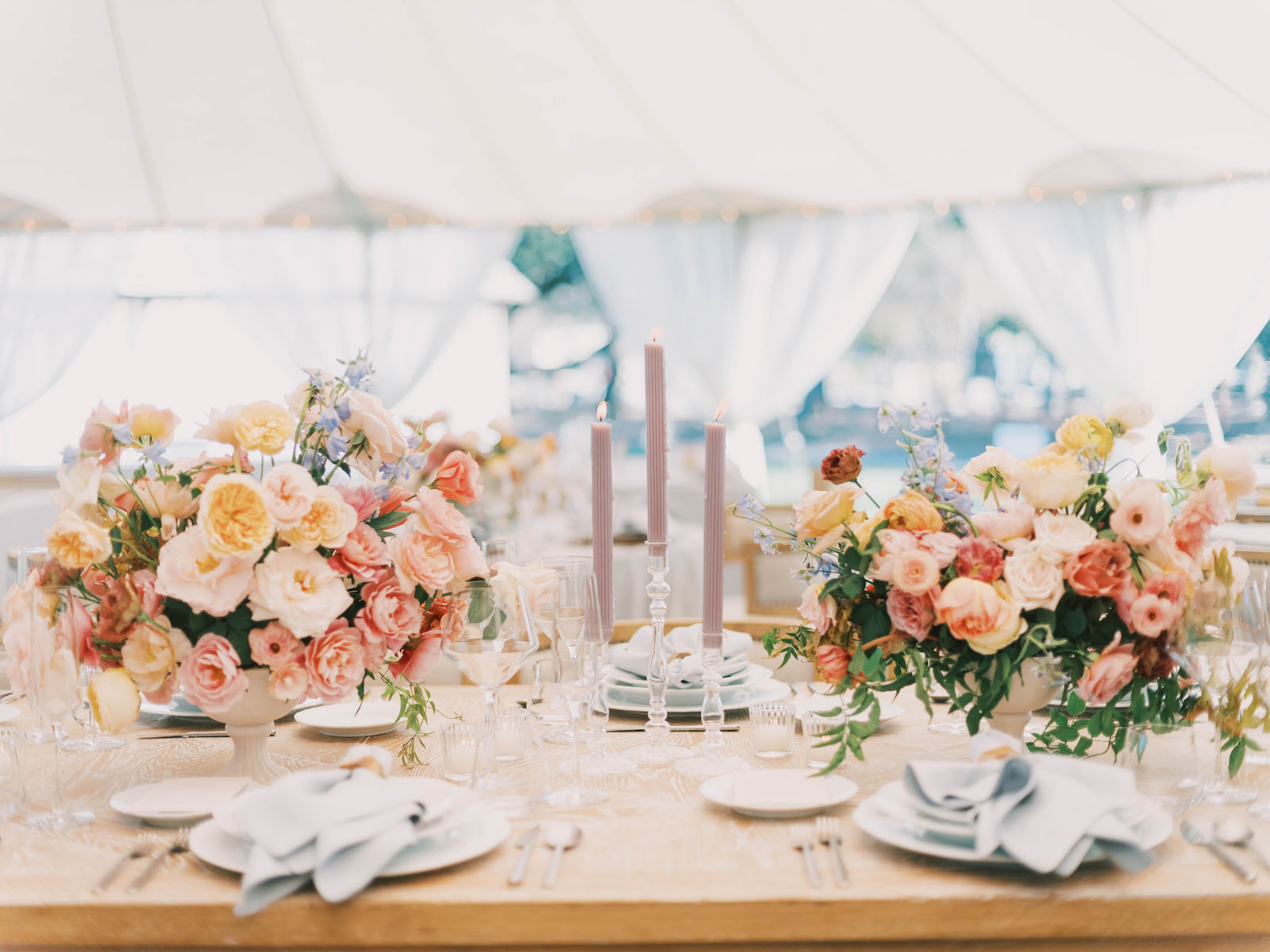 Gorgeous reception place setting in sailcloth tent